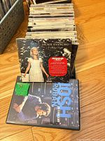Stack of CDs in bin with Jackie Evancho and Josh Groban cases front