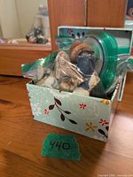 Box holding bags of miniature figurines