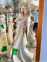 Front view of Royal Doulton Windswept figurine in display cabinet