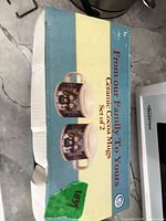 Retail box front showing label 'Ceramic Cocoa Mugs Set of 2'