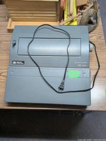 Top view of Smith Corona SD 850 typewriter showing keyboard cover and power cord