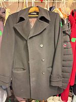 Full front view of black Stonehouse pea coat on hanger