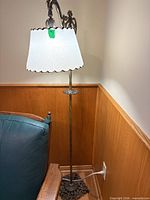 Full view of brass floor lamp with shade showing height, base, arm, and shade