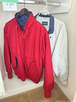 Front view of both windbreakers hanging