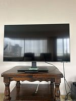 Front view of Samsung 43" smart TV on stand