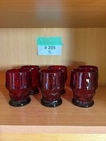 Six ruby red Viking Georgian Honeycomb tumblers on shelf