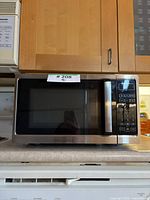Front view of Insignia 0.7 cu ft microwave showing control panel and door