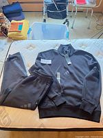 Track suit laid out showing both jacket and pants