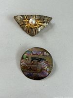 Both brooches overview