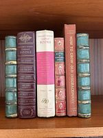 Bookends flanking real books showing decorative spines