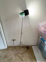 Full lamp showing tripod base, stand and head