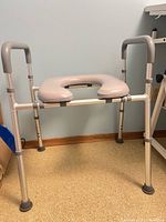 Overall view of aluminum safety frame with raised toilet seat