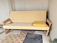 Front view of futon assembled with cushions