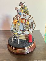 Front view of firefighter figurine with plate and base