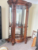 Full view of curved glass solid wood curio cabinet