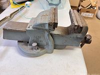 Left side view showing overall vise, body color, swivel base and jaws