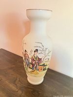 Full view of milk glass vase showing painted Asian figures and overall shape