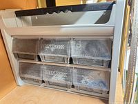 Front view showing six clear drawers marked Bin Box