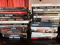 Two stacks of DVD cases showing spines for title identification