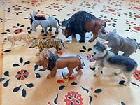 Group shot of all seven plastic animal figures