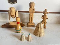 Group shot of all seven carved wood items