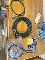 Group shot of hoses, flex shaft, wheels, Loctite kit