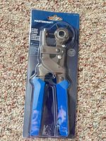 Front view of sealed Mastercraft rotary leather punch pliers showing tool and packaging
