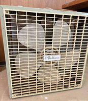 Front view of Parklane box fan showing blades and grille