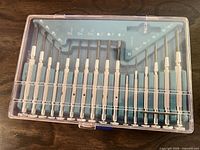 Closed clear-lid case showing all 18 screwdrivers arranged in tray