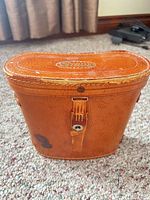 Brown leather Stellar-branded carrying case exterior