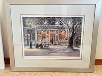 Full view of framed print showing artwork, mats, and silver metal frame