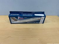 Front view of boxed SkyMarks Air Canada model airplane