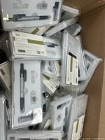 Box filled with packaged Mr. Pen compass sets