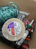 Box overview showing 3M tape, Sikaflex tube, green line, red wire, black item