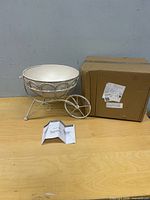 Planter bowl on stand next to original box