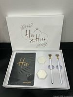 Set in presentation box showing His vow book, two pens, two hexagonal boxes