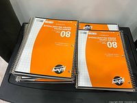 Stack of Hilroy graph notebooks on plastic lid