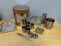 overview of all stainless steel items, decorative stands, trivet, bangles