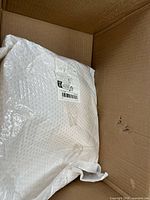 Box interior with sealed bubble-mailer