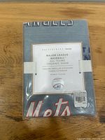 Front of sealed package showing product label and MLB graphics