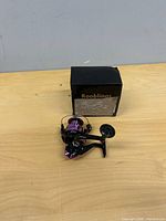 Reel beside original box