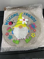 Front of colourful gnome stepping stone with text