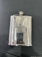 Stainless steel hip flask engraved “Canadian Club Reserve” front view