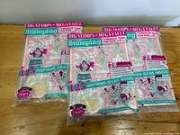 Three sealed Creative Stamping packs front view