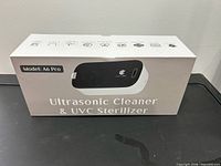 Front view of sealed box showing model name and product image