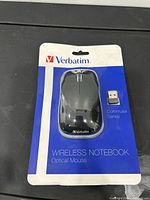 Front view of retail-packaged Verbatim wireless notebook optical mouse and receiver