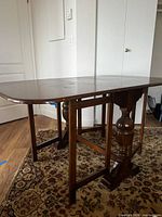 Table fully opened showing top and leaves
