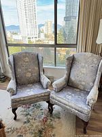 Pair of floral wingback chairs front view