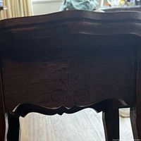 Close-up of carved apron detail and underside finish