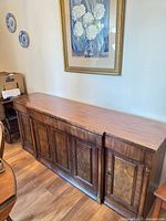 Front and top view of solid wood buffet sideboard credenza under framed artwork